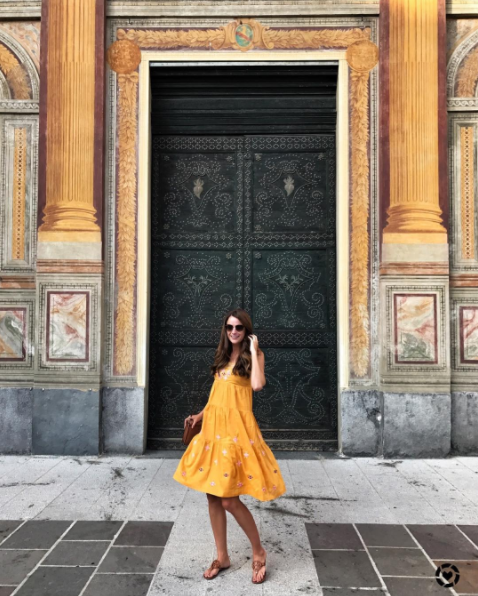 The miller affect wearing a yellow madewell dress in como, italy