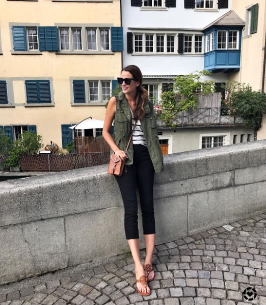 The Miller Affect wearing a green utility vest and a stripe top in Zurich