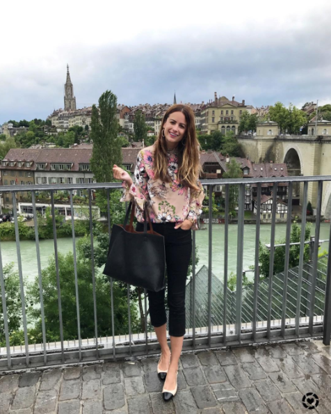 The Miller Affect wearing a floral ruffle Chicwish top with black crop pants in Bern Switzerland