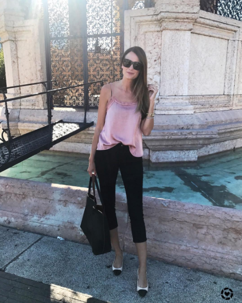 The Miller Affect wearing a pink lace cami and black crop pants in Geneva