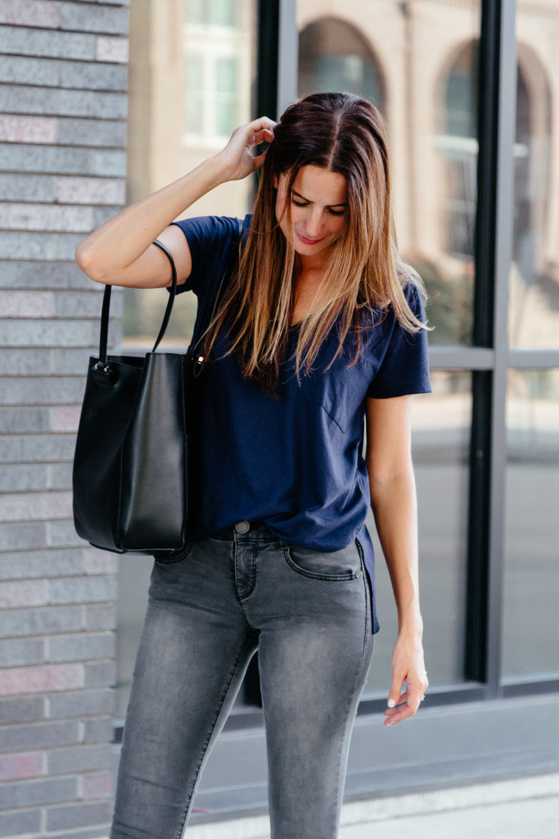 The Miller Affect wearing a $15 navy pocket tee and a $28 black tote from the Nordstrom Anniversary Sale