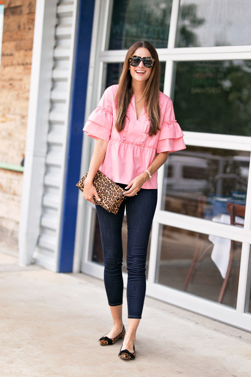 The Miller Affect wearing a pink poplin top from Ann Taylor
