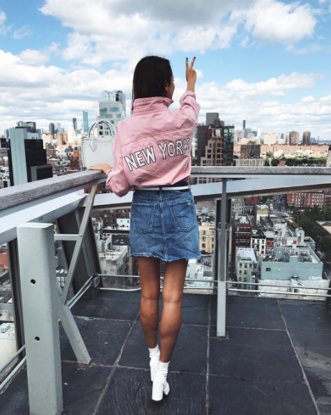 The Miller Affect wearing a pink denim New York top and a denim skirt