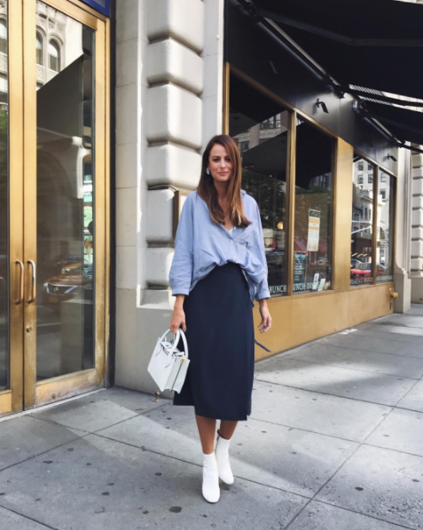The Miller Affect wearing a blue oversized top with a navy midi skirt from ASOS