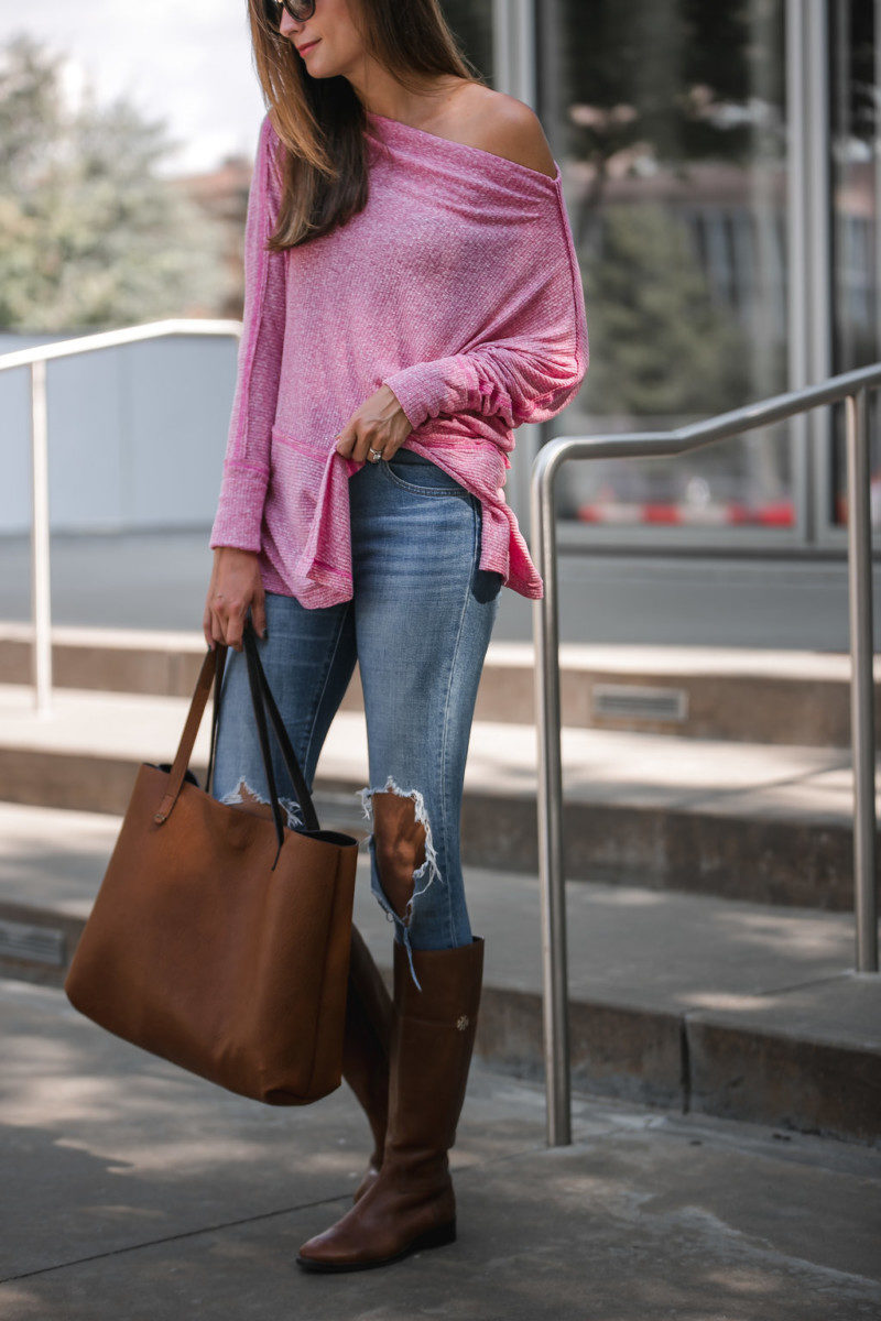 The Miller Affect wearing high rise distressed levi's with cognac riding boots