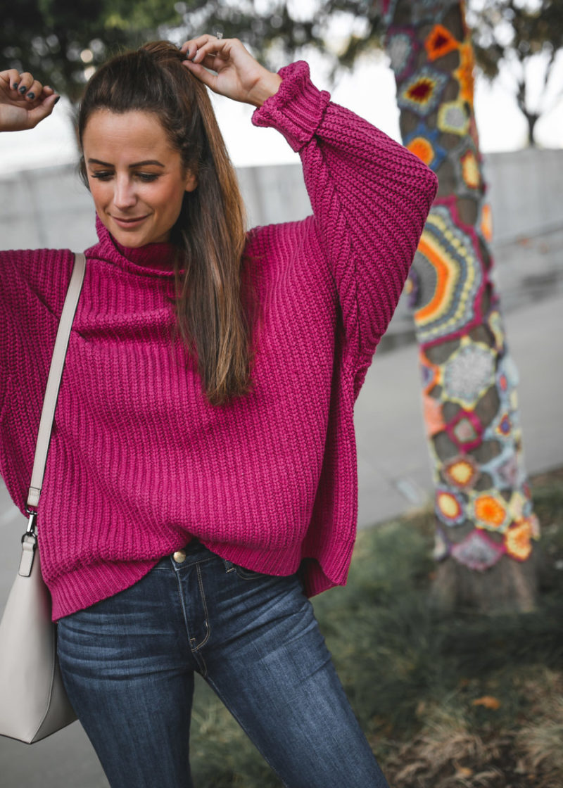 The Miller Affect wearing a chunky free people sweater for her pink sweater series