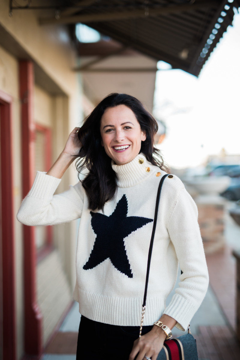 the miller affect wearing a star knit pullover