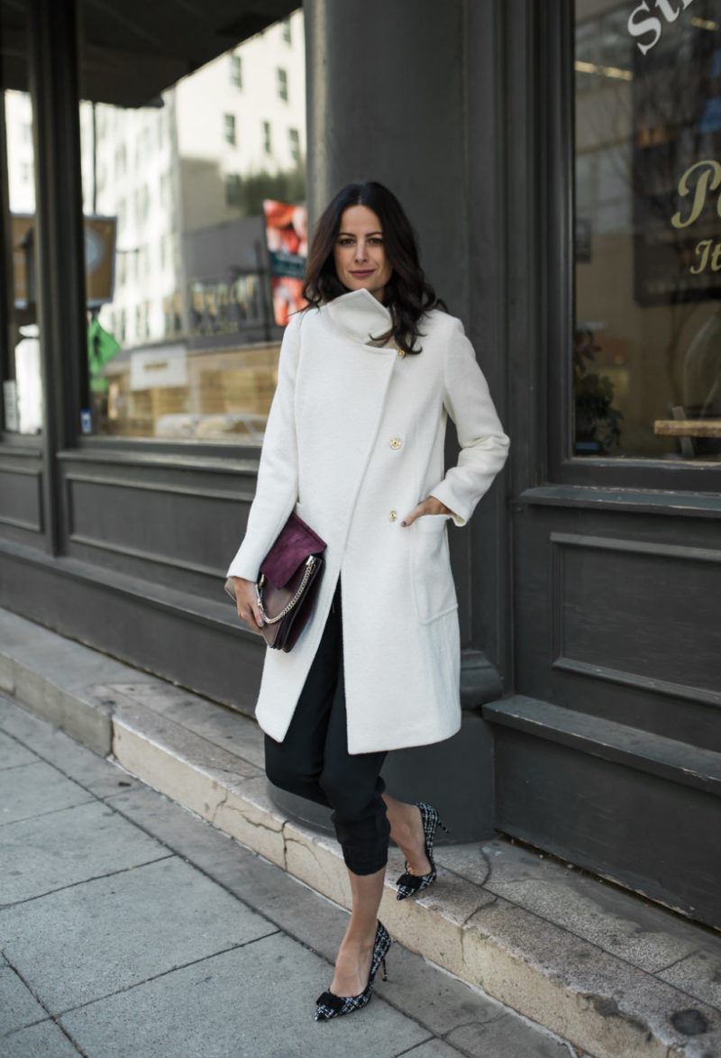 The Miller Affect wearing a white coat from Ann Taylor