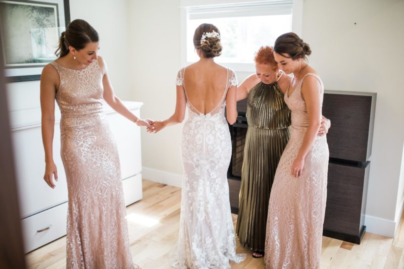 The Miller Affect wearing a white backless wedding dress from Berta