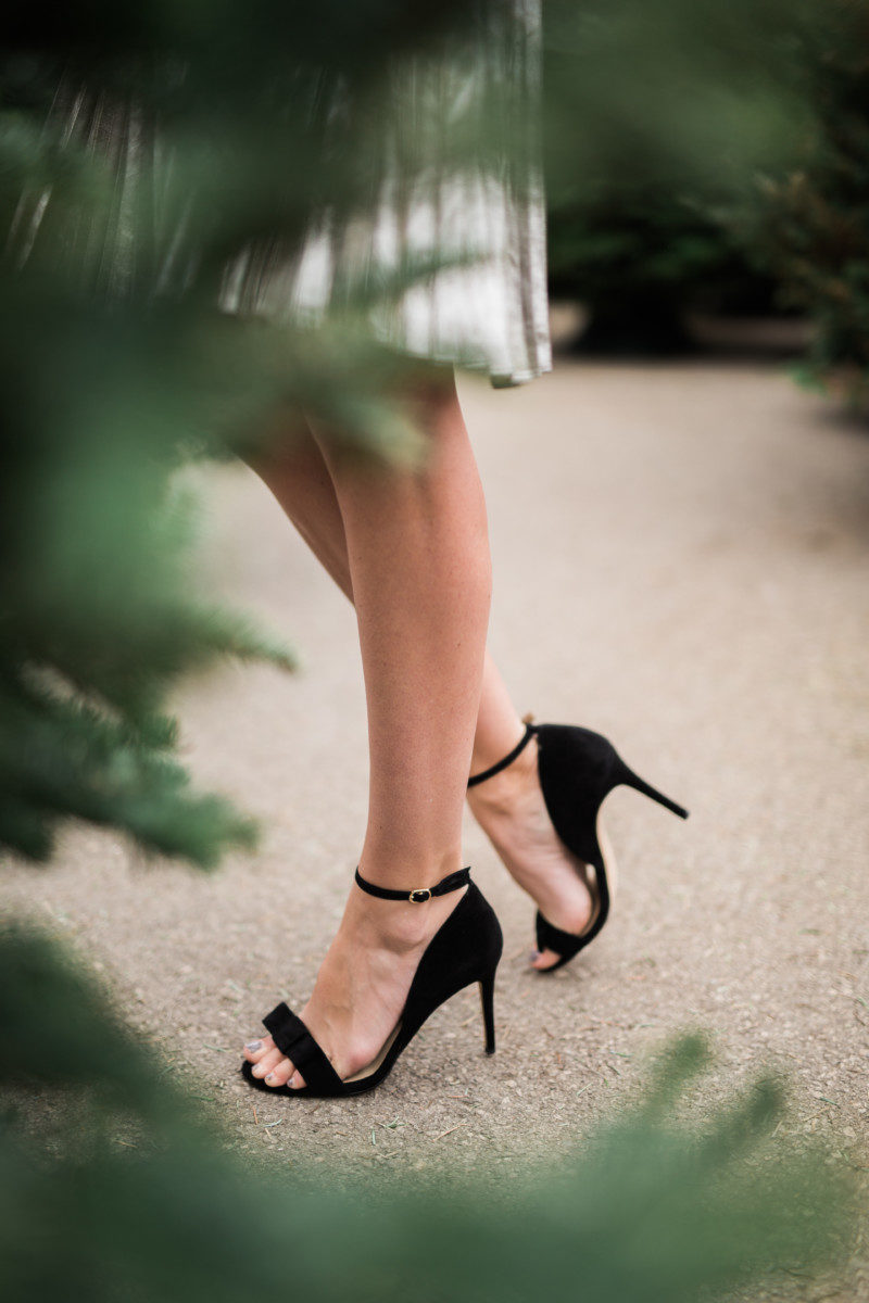 the miller Affect wearing black bow heels from Ann Taylor