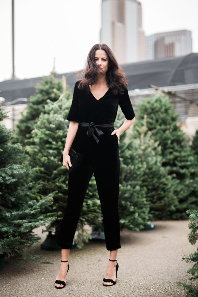 The Miller Affect wearing a black jumpsuit for holiday season