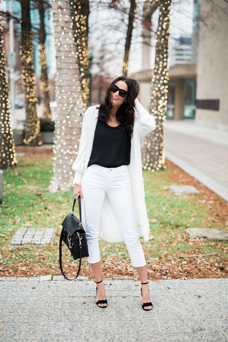 the miller affect wearing white jeans with black sandals