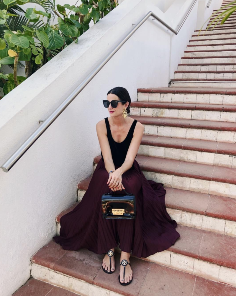 The Miller Affect wearing a wine pleated maxi skirt