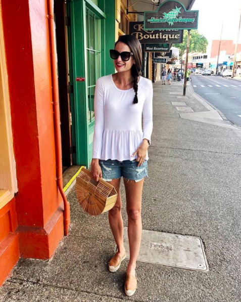 the miller affect wearing a white peplum top in Lahaina Maui