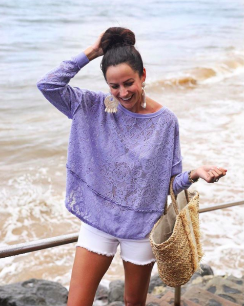 the miller affect wearing a purple free people top