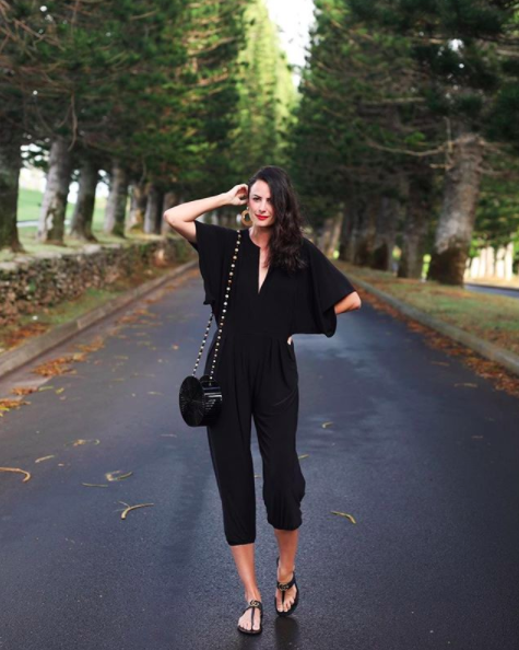 the miller affect wearing a black jersey jumpsuit from shopbop