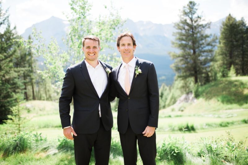 The Miller Affect groomsmen wearing navy suits and pink ties