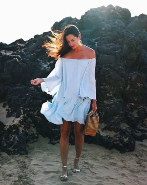 the miller affect wearing a baby blue off the shoulder dress from lilly pulitzer
