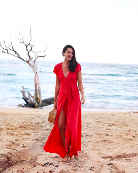 the miller affect wearing a red maxi dress for Feast of Lele luau in Lahaina