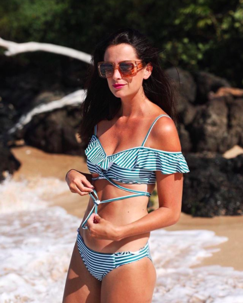 the miller affect wearing an isabella rose stripe two piece swimsuit