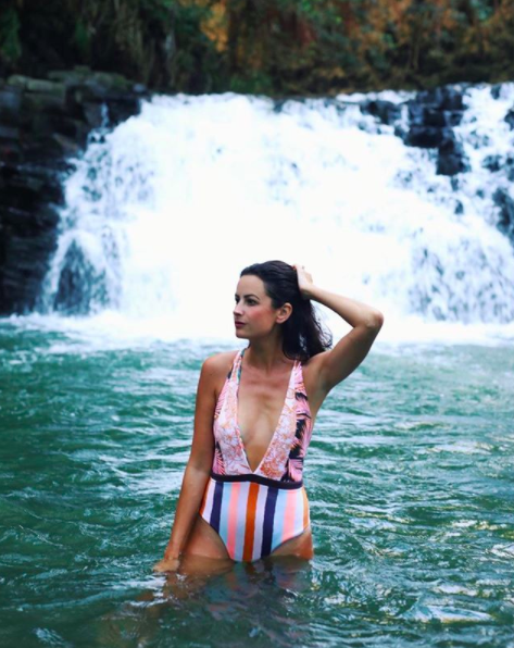 the miller affect wearing a striped reversible swimsuit from shopbop