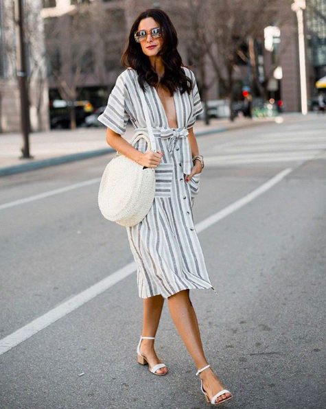The Miller Affect wearing a linen free people plunge dress