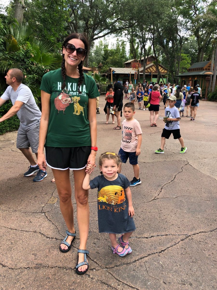 the miller affect wearing disney clothes from lion king at disney world