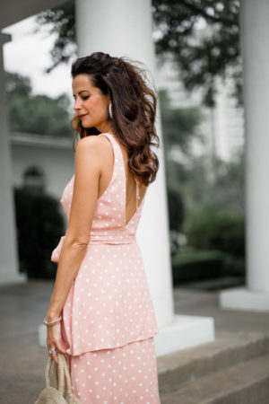 the miller affect wearing a pink maxi dress to a summer wedding