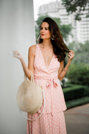 the miller affect wearing a pink maxi dress to a summer wedding