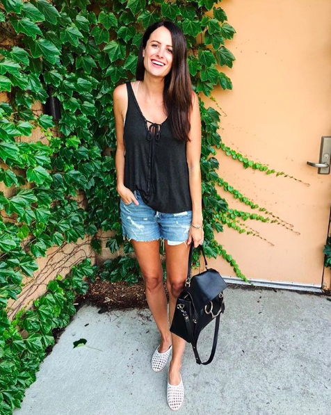 the miller affect wearing a black free people tank