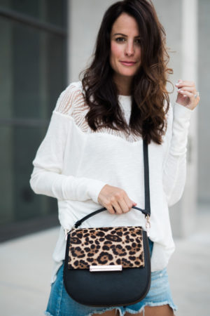the miller affect wearing a free people ivory thermal top
