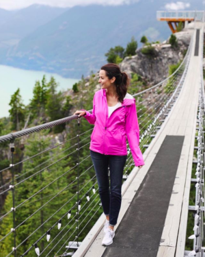 the miller affect wearing a pink northface jacket on top of the sea to sky gondola