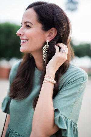 the miller affect wearing new earrings from Kendra Scott