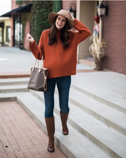 the miller affect in rust sweater and neverfull bag