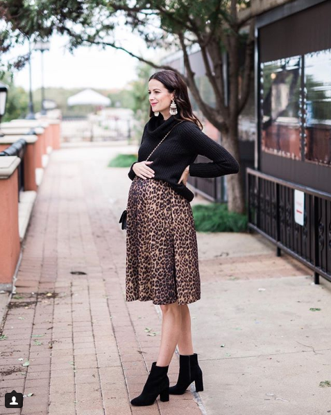 The miller affect leopard skirt, black sweater, and black booties