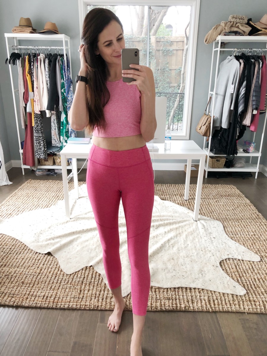 the miller affect wearing hot pink workout leggings and a pink sports bra from outdoor voices