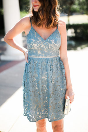 the miller affect wearing a blue lace dress from justfab