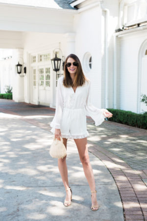 the miller affect wearing white lace romper