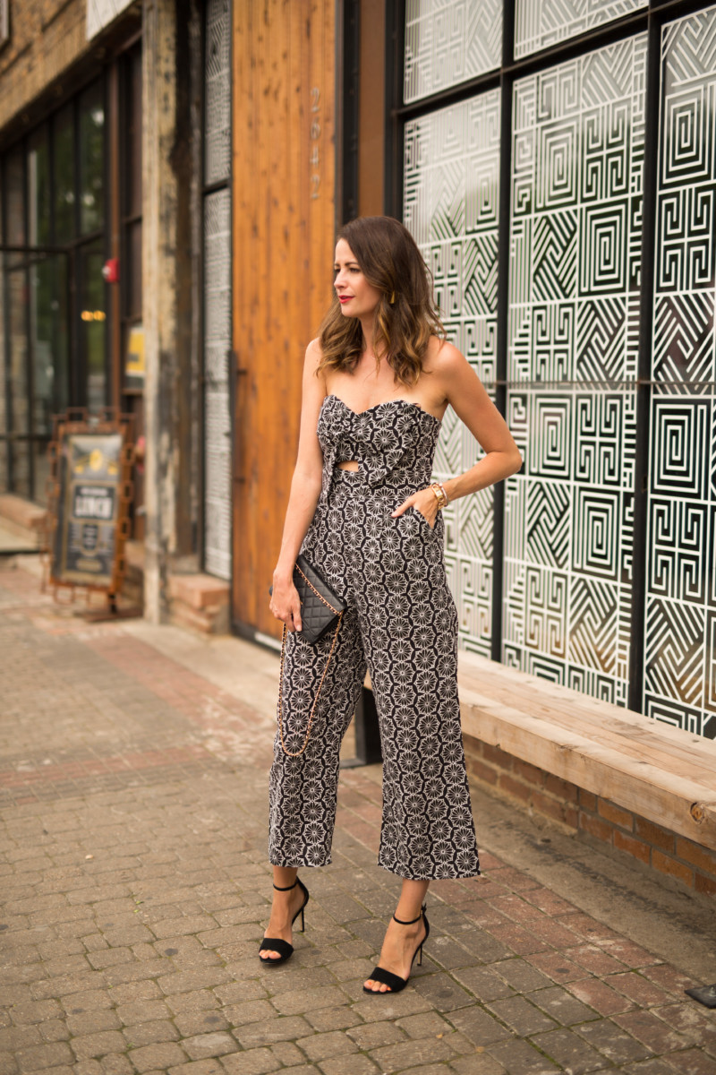 the miller affect wearing a bardot lace jumpsuit