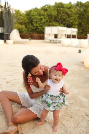 the miller affect with her baby on vacation wearing nordstrom