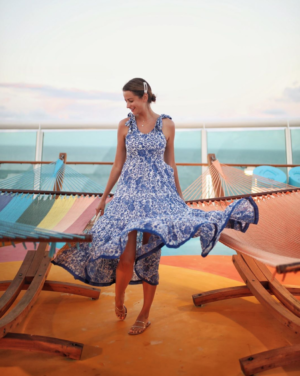 the miller affect wearing a blue maxi dress on royal caribbean cruises