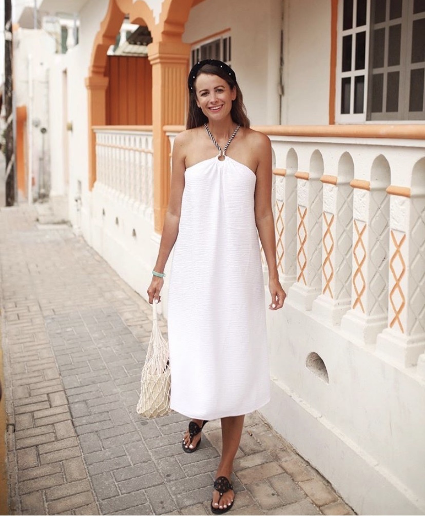 themilleraffect.com wearing a white midi dress with rope straps