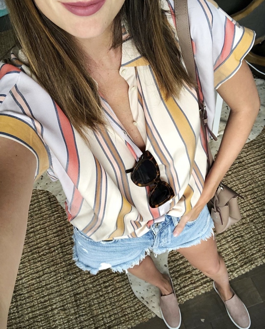 themilleraffect.com wearing a madewell striped top and denim shorts