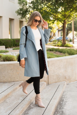 the miller affect wearing a blue sam edelman coat from the N Sale