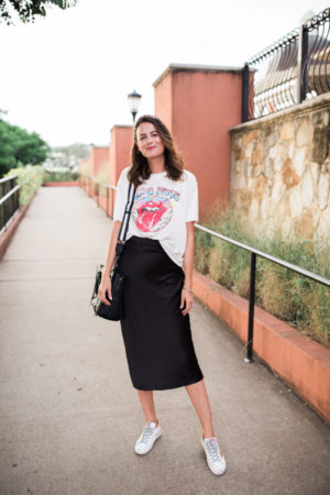 the miller affect styling golden goose sneakers with midi skirt