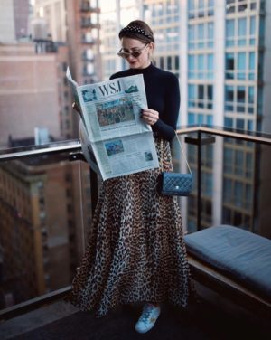 the miller affect wearing a leopard ganni skirt and commando bodysuit at NYFW