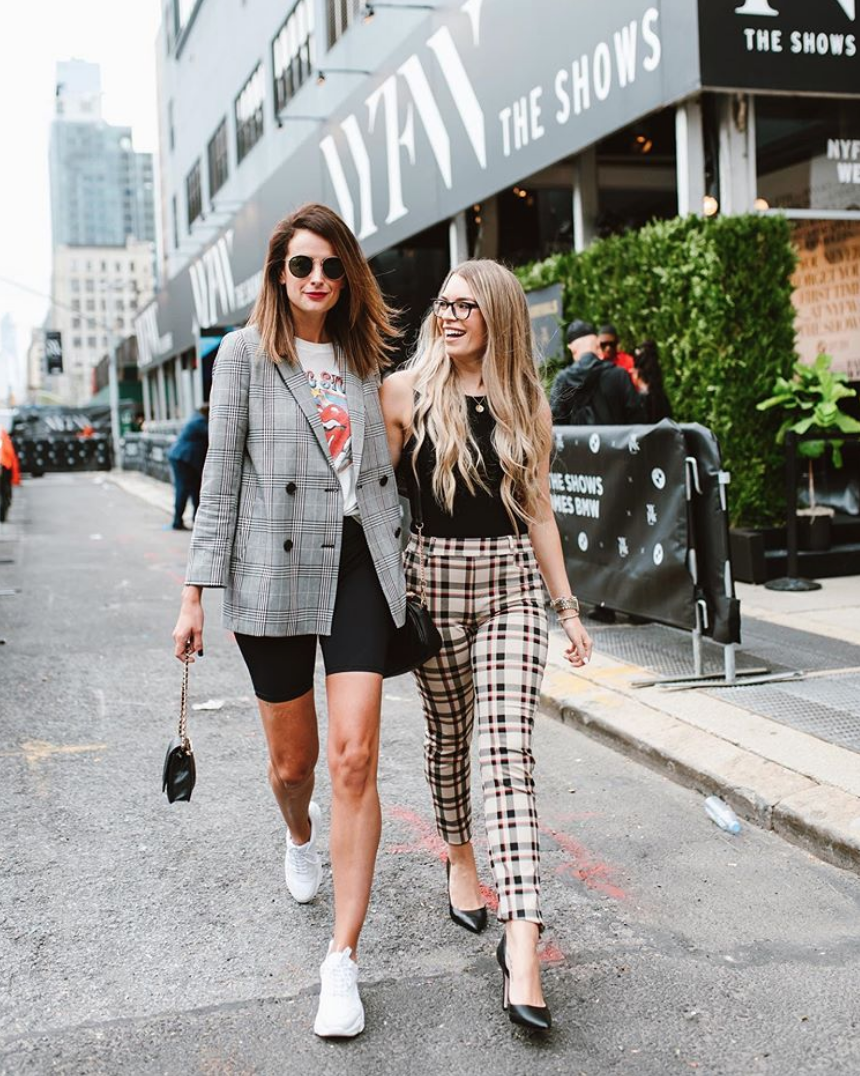 the miller affect wearing a madewell plaid blazer and biker shorts at NYFW