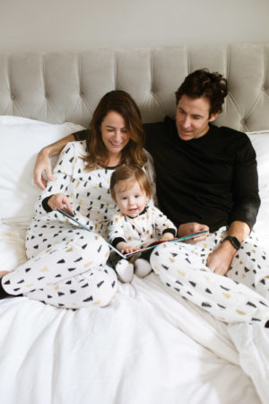 the miller affect and family wearing matching holiday pajamas