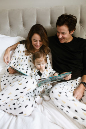 the miller affect and family wearing christmas tree pajamas