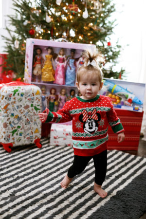 the miller affect baby wearing a minnie mouse holiday sweater